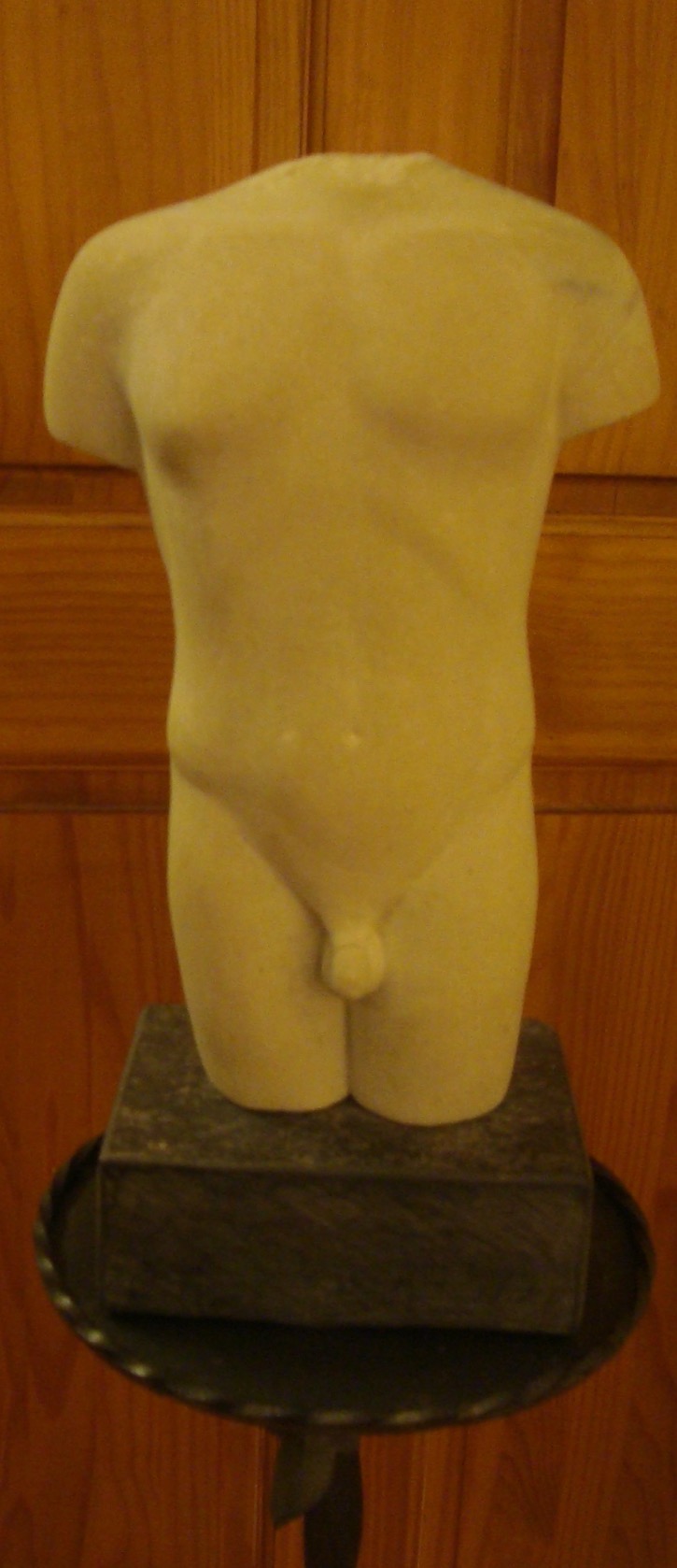 Stone carving of torso
